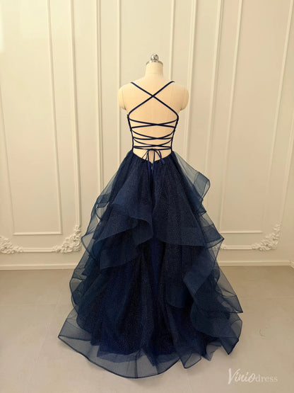 Navy blue glitter tulle ball gown with a lace-up corset back and dramatic tiered ruffle skirt on a mannequin.