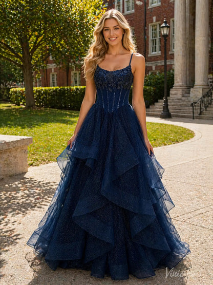 Navy blue glitter tulle ball gown with a beaded corset bodice, spaghetti straps, and a dramatic tiered ruffle skirt.