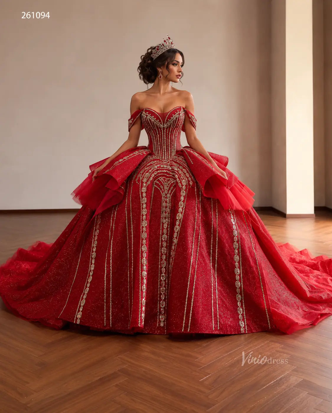 Red off-shoulder quinceañera ball gown with gold-beaded vertical patterns, sculptural peplum, and a sweeping train.