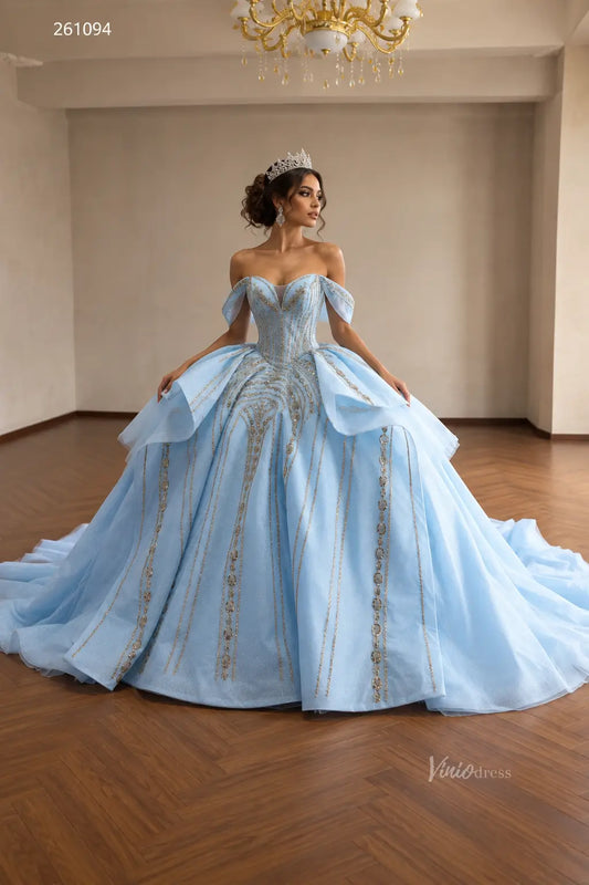 Light blue quinceañera ball gown with gold beaded vertical patterns, off-shoulder sweetheart neckline, and sculptural peplum.