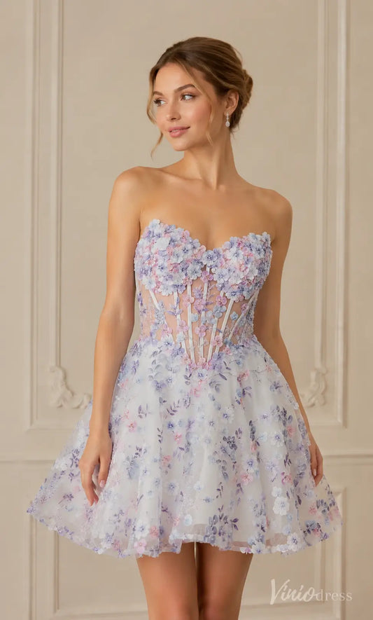 White strapless mini dress with purple and pink floral embroidery, sheer corset bodice.