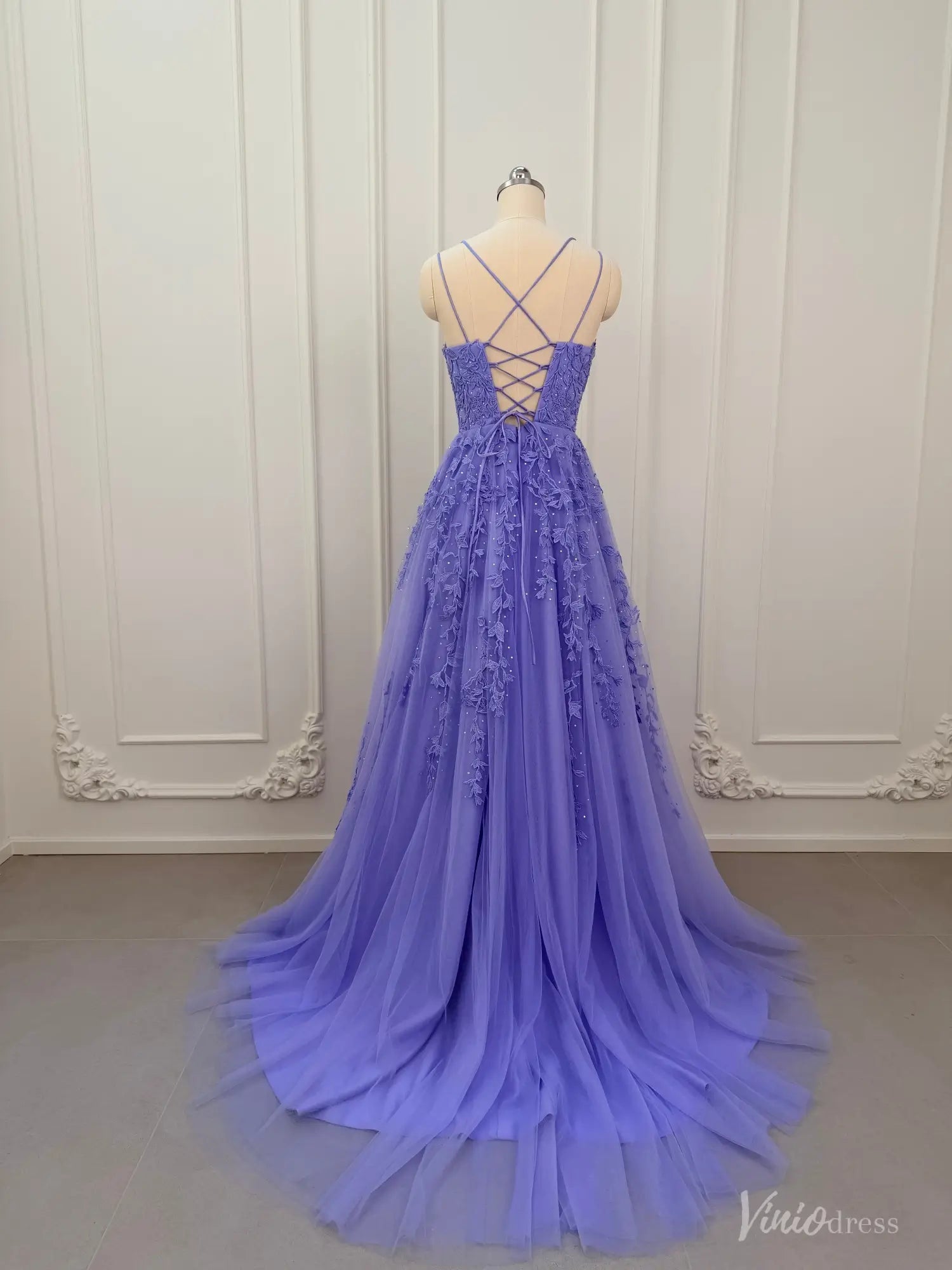 Lavender A-line prom dress with floral appliqué, tulle skirt, and corset lace-up back on a mannequin.