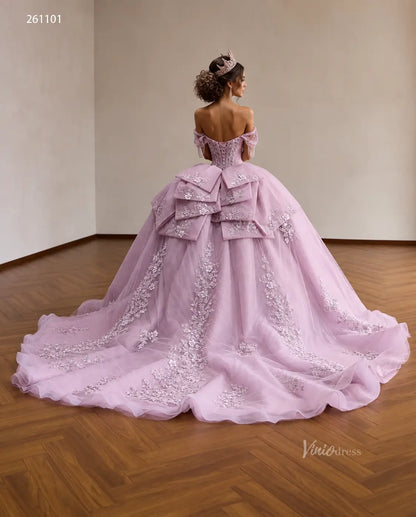 Lilac quinceañera ball gown with a crystal corset, 3D floral appliqués, off-shoulder straps, and a layered back bow.