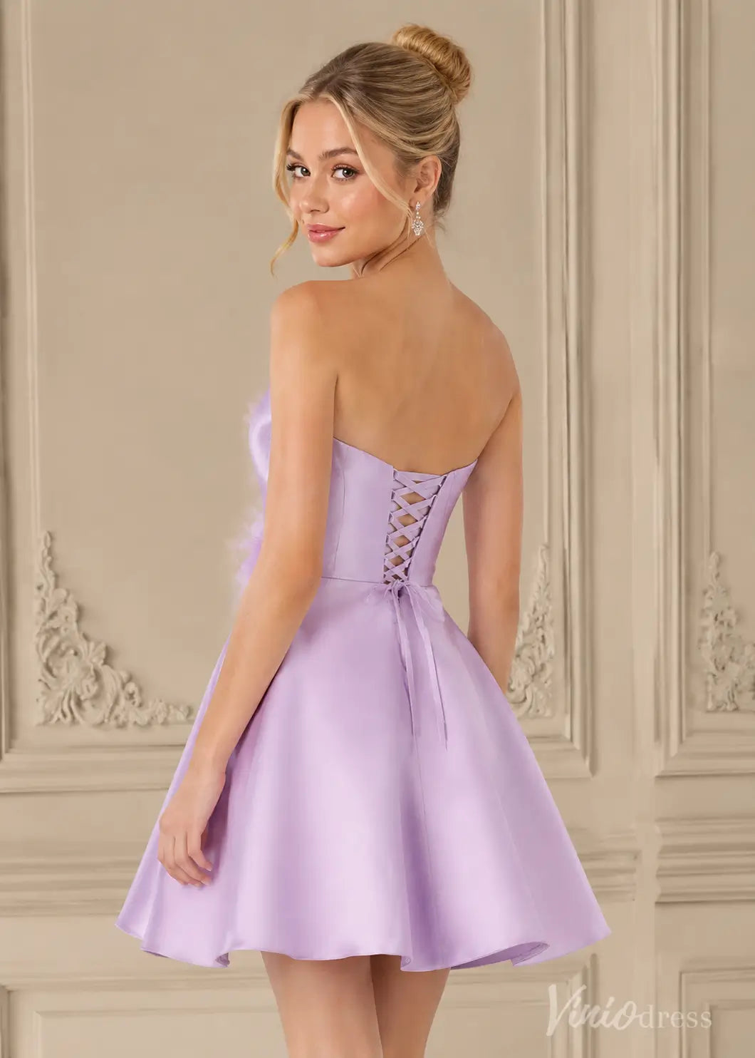 Lavender satin strapless mini dress with a corset lace-up back and feathered bust detail.