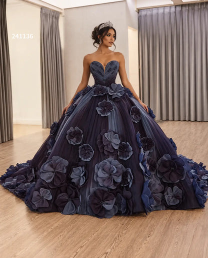 Luxury navy blue ball gown with a sweetheart neckline and 3D floral petal appliqués on a full tulle skirt with a train.