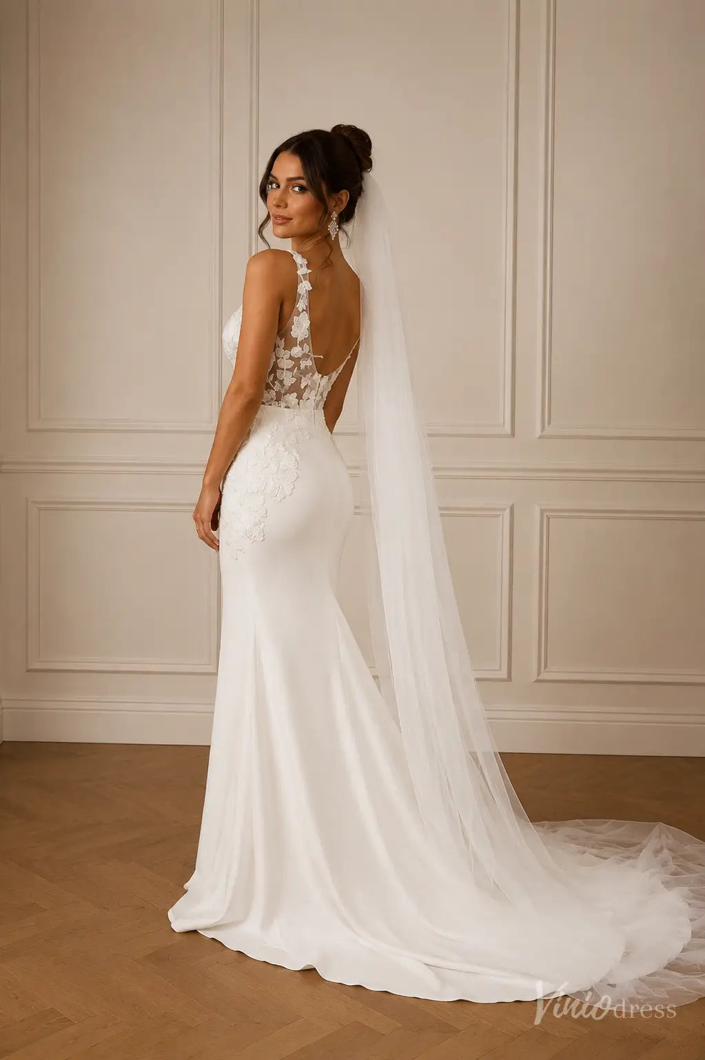 ML191 white mermaid wedding dress with a lace illusion back, floral applique details, and a long tulle veil.