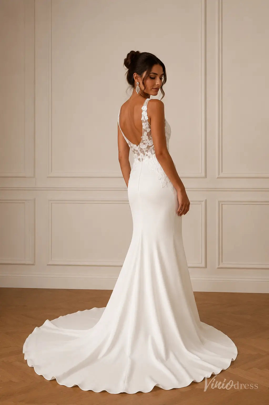 ML191 white mermaid wedding dress with a low back, floral lace bodice, and a sleek crepe skirt with a train.