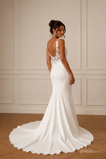 ML191 white mermaid wedding dress with a low back, floral lace bodice, and a sleek crepe skirt with a train.