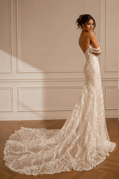 ML194 off-the-shoulder ivory wedding dress with intricate floral lace, a fitted bodice, and a flowing cathedral train.