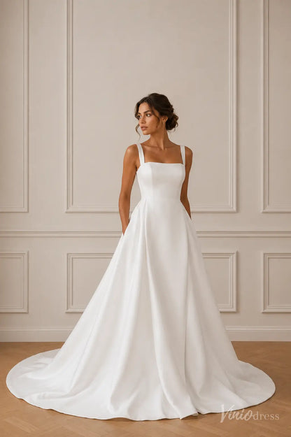 Minimalist white satin A-line wedding dress with a square neckline, thick straps, and side pockets.
