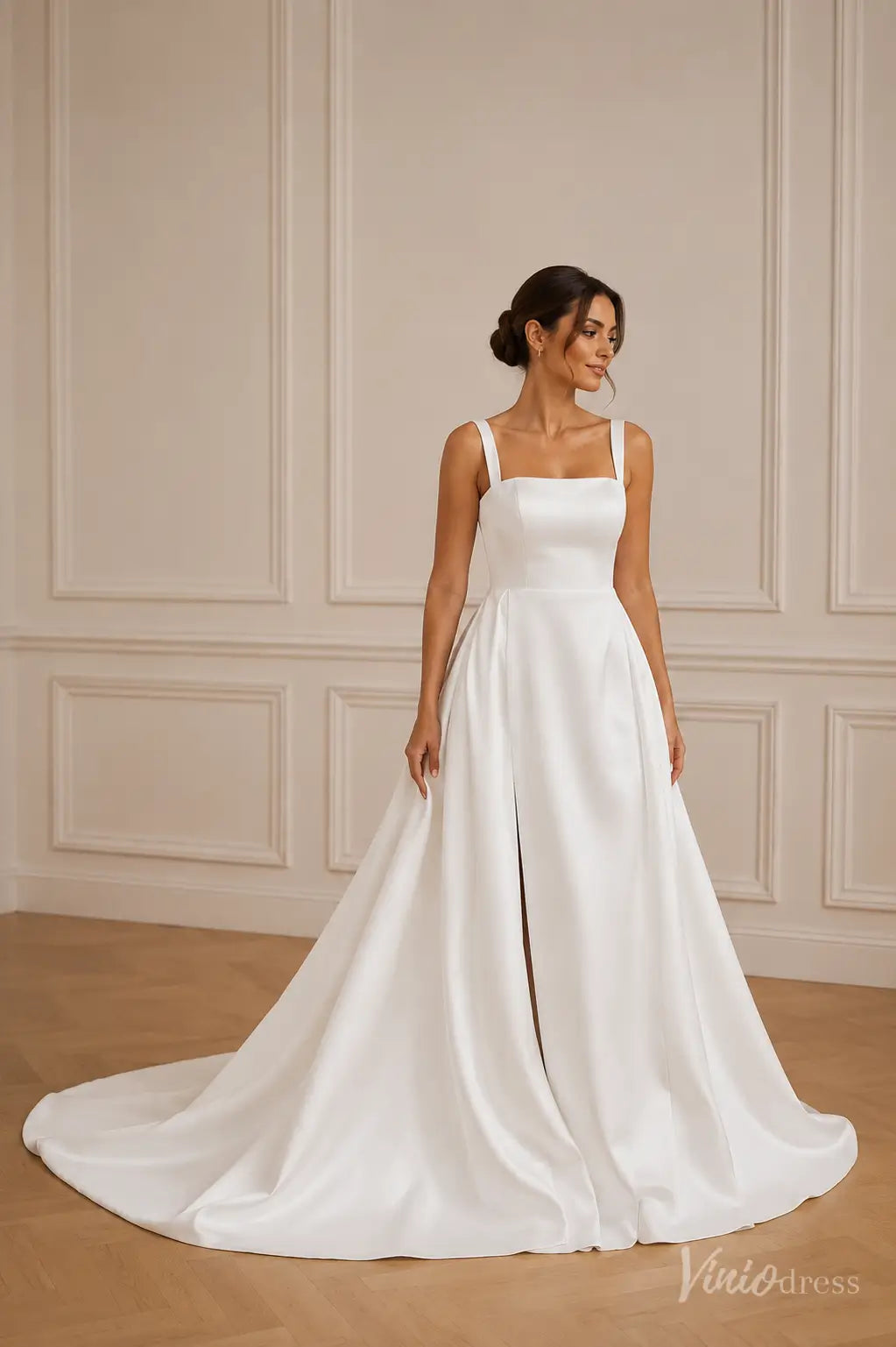 Satin A-line wedding dress with a square neckline, thick straps, and a high front slit with a sweeping train.