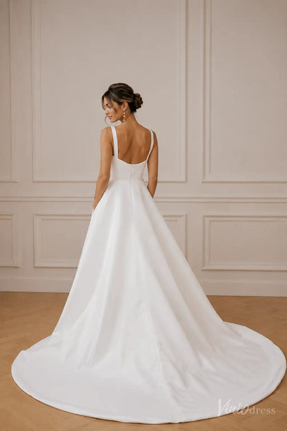 Minimalist white A-line wedding dress with a square neckline, thick straps, and a sweeping train.