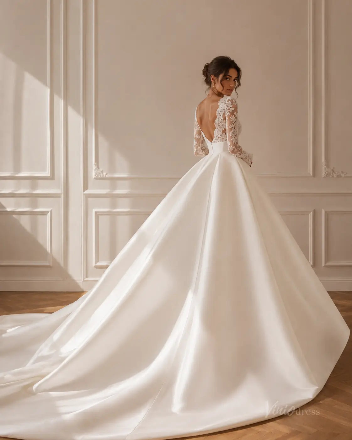 MS189 white satin ball gown wedding dress with long lace sleeves, an open back, and a dramatic floor-length train.