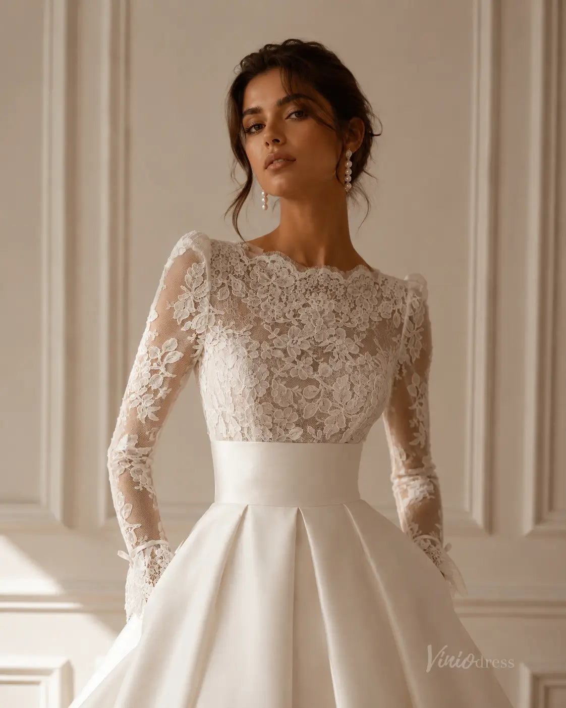 Elegant MS189 wedding dress featuring a sheer lace long-sleeve bodice and a smooth satin A-line skirt with a wide waistband.