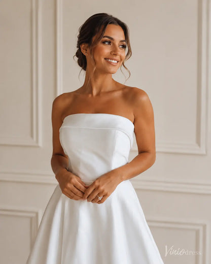 Elegant white strapless Mikado wedding dress with a clean, minimalist bodice and full A-line skirt.