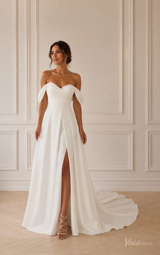 Minimalist white satin A-line wedding dress with off-shoulder sweetheart neckline, ruched bodice, and high leg slit.