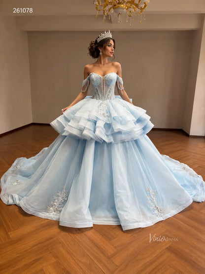 Mint green convertible ball gown with beaded corset bodice, off-shoulder sleeves, ruffled overskirt, and floral appliqué.