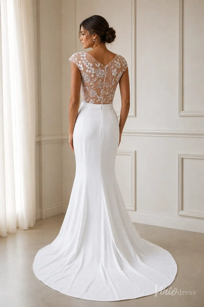 Modern white crepe mermaid wedding dress with a sheer illusion back and delicate floral lace embroidery.