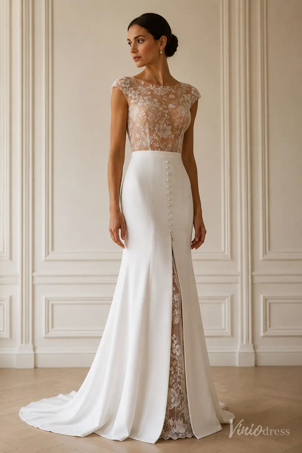 Modern white crepe mermaid wedding dress with illusion floral lace bodice, bateau neckline, and front slit.