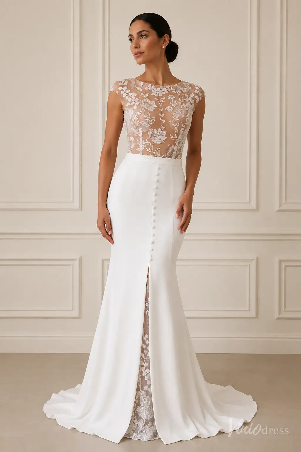 Modern white crepe mermaid wedding dress with illusion floral lace bodice, bateau neckline, and front lace-lined slit.