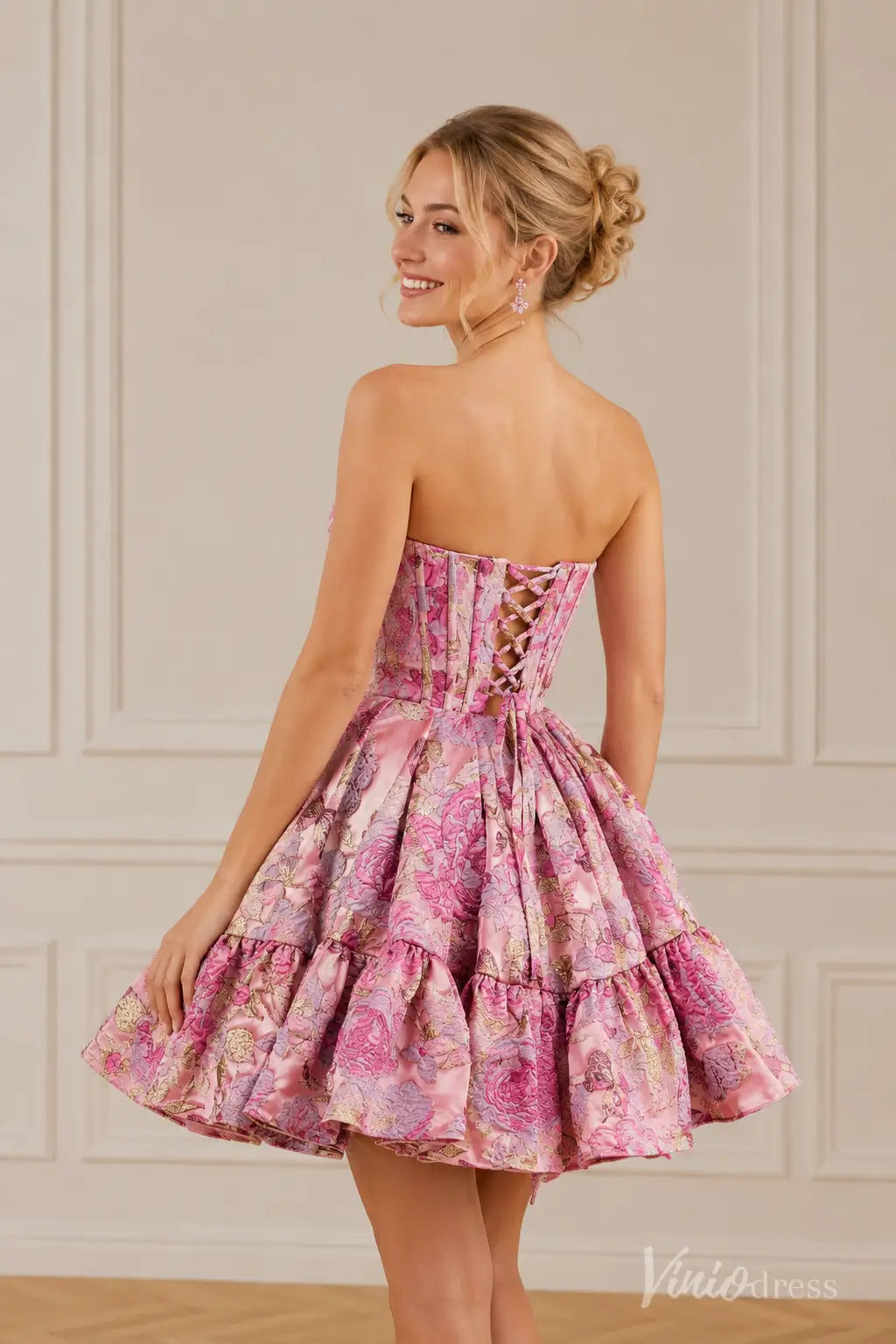 Pink floral brocade strapless short dress with a lace-up corset back.
