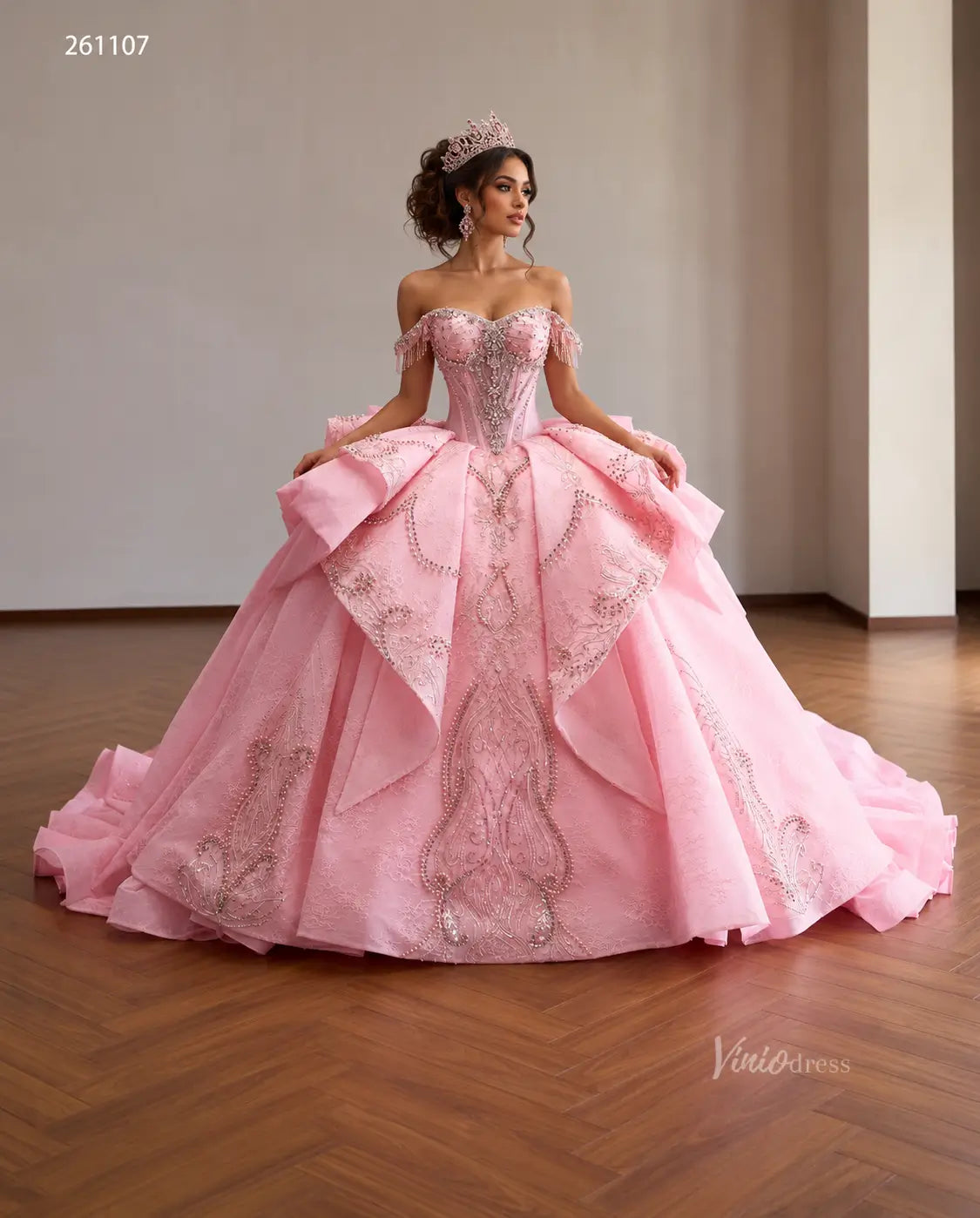 Pink off-shoulder quinceañera dress with crystal corset, layered overskirt, and ornate beaded embroidery.