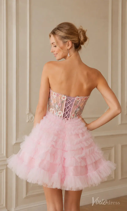 Pink strapless mini dress with ruffled tulle skirt and floral embroidered corset bodice with lace-up back.