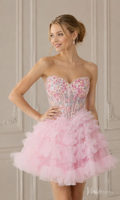 Pink strapless mini dress with a floral embroidered sweetheart bodice and a ruffled tulle skirt.