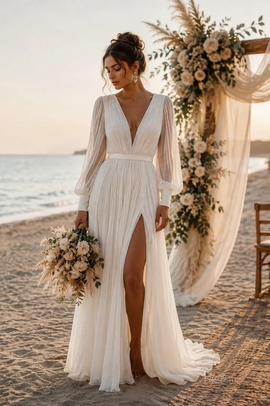 Boho wedding dress CN012 featuring a deep V-neck, pleated bodice, sheer long sleeves, and a high leg slit on a beach.