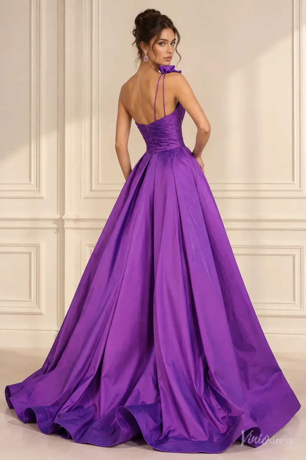 Purple satin one-shoulder prom dress with 3D floral accents, ruched bodice, and a voluminous floor-length overskirt.