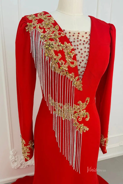 Red long sleeve evening dress with gold beaded lace and silver fringe detailing.