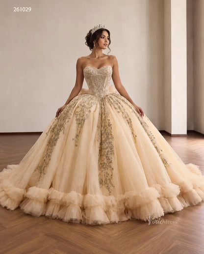 Champagne quinceañera ball gown with beaded corset bodice, metallic embroidery, and a ruffled hemline.