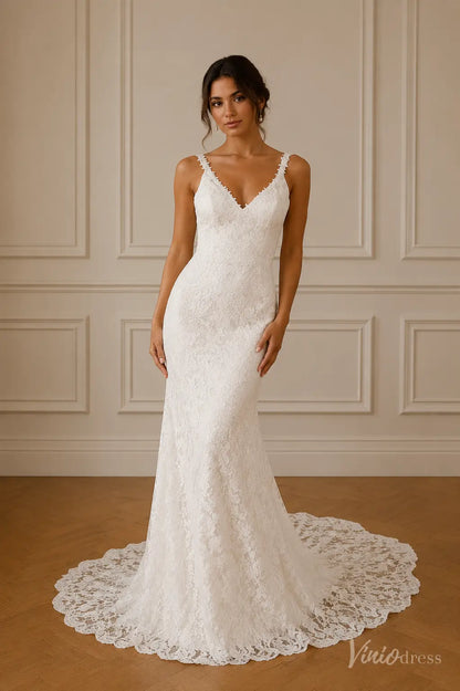 Boho white lace mermaid wedding dress with a V-neckline, delicate straps, and a scalloped floral lace train.