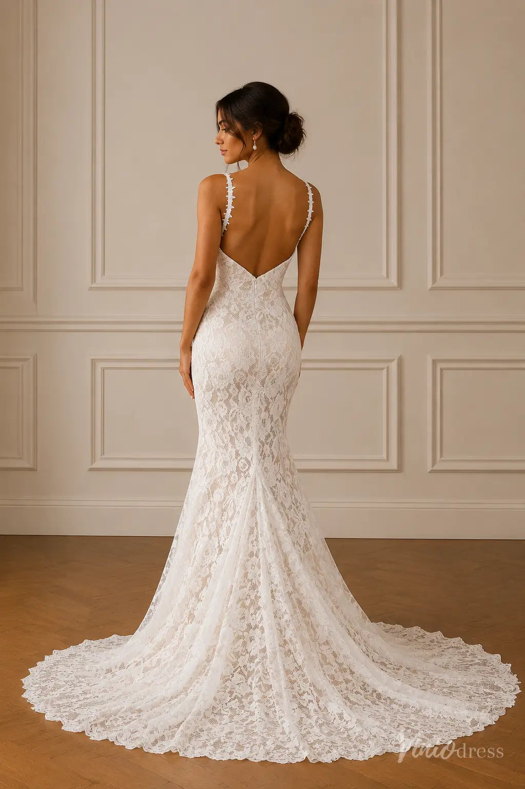 Boho mermaid wedding dress in white floral lace with a low V-back, delicate straps, and a scalloped lace train.