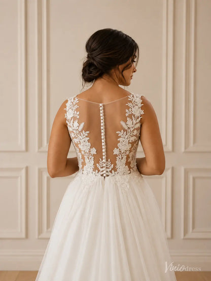 White A-line wedding dress with an illusion lace back, floral embroidery, and a delicate row of fabric buttons.