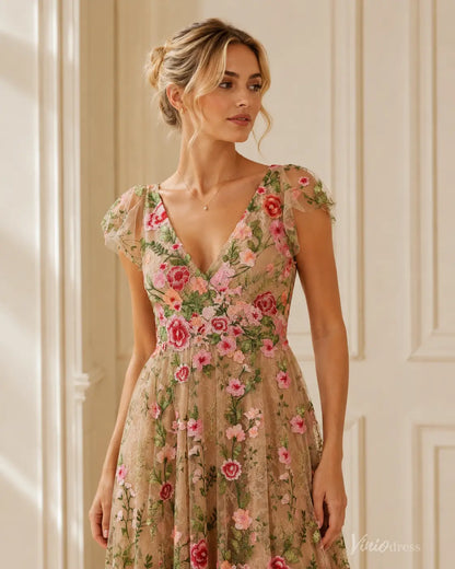 Midi-length V-neck evening dress in beige with colorful floral embroidery, cap sleeves, and a feminine wedding guest style.
