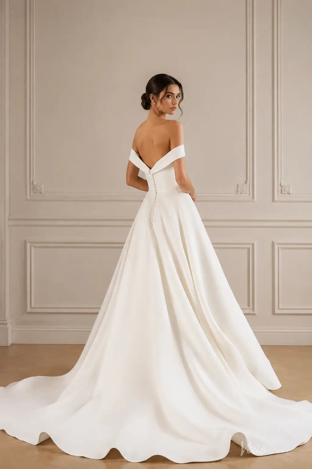 Ivory satin A-line wedding dress with off-shoulder sleeves, deep V-back, and elegant button-down detail.