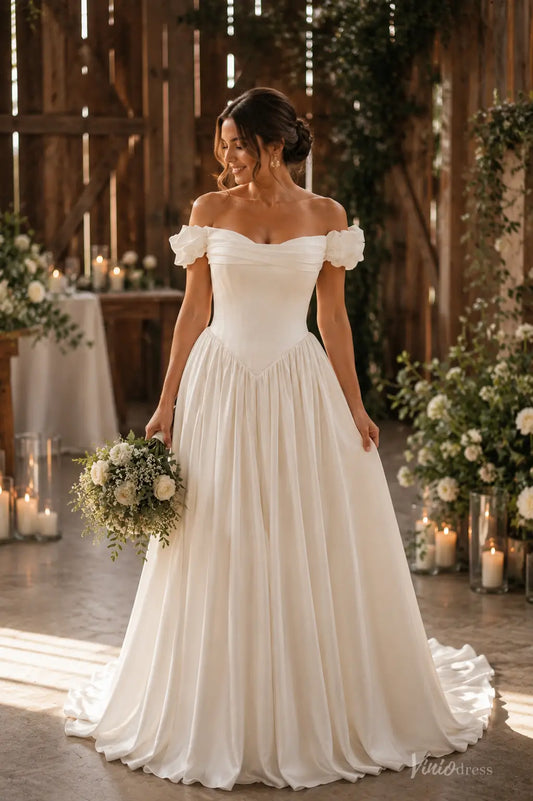 Ivory satin A-line wedding dress with ruffled off-shoulder sleeves, sweetheart neckline, and a structured Basque waist.