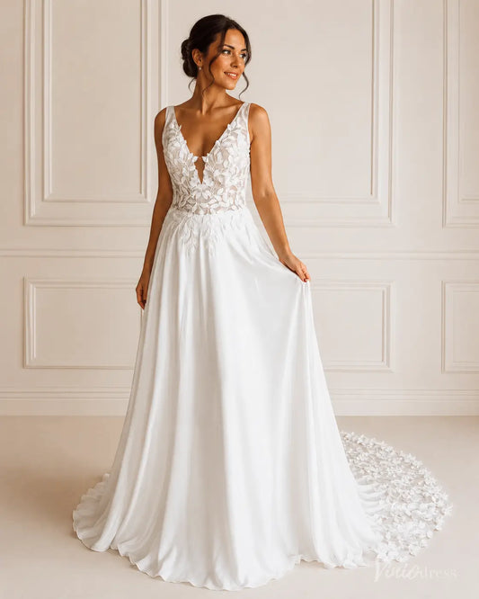 White A-line wedding dress with a deep V-neckline, floral lace bodice, and a flowing chiffon skirt with a long train.