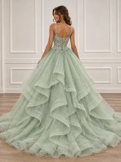 Sage green glitter tulle ball gown with a lace corset back and voluminous ruffled skirt for prom.