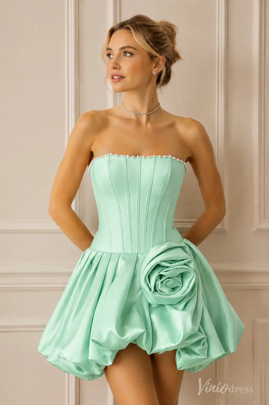 Mint green strapless mini dress with pearl trim, corset bodice, and large side rose detail.