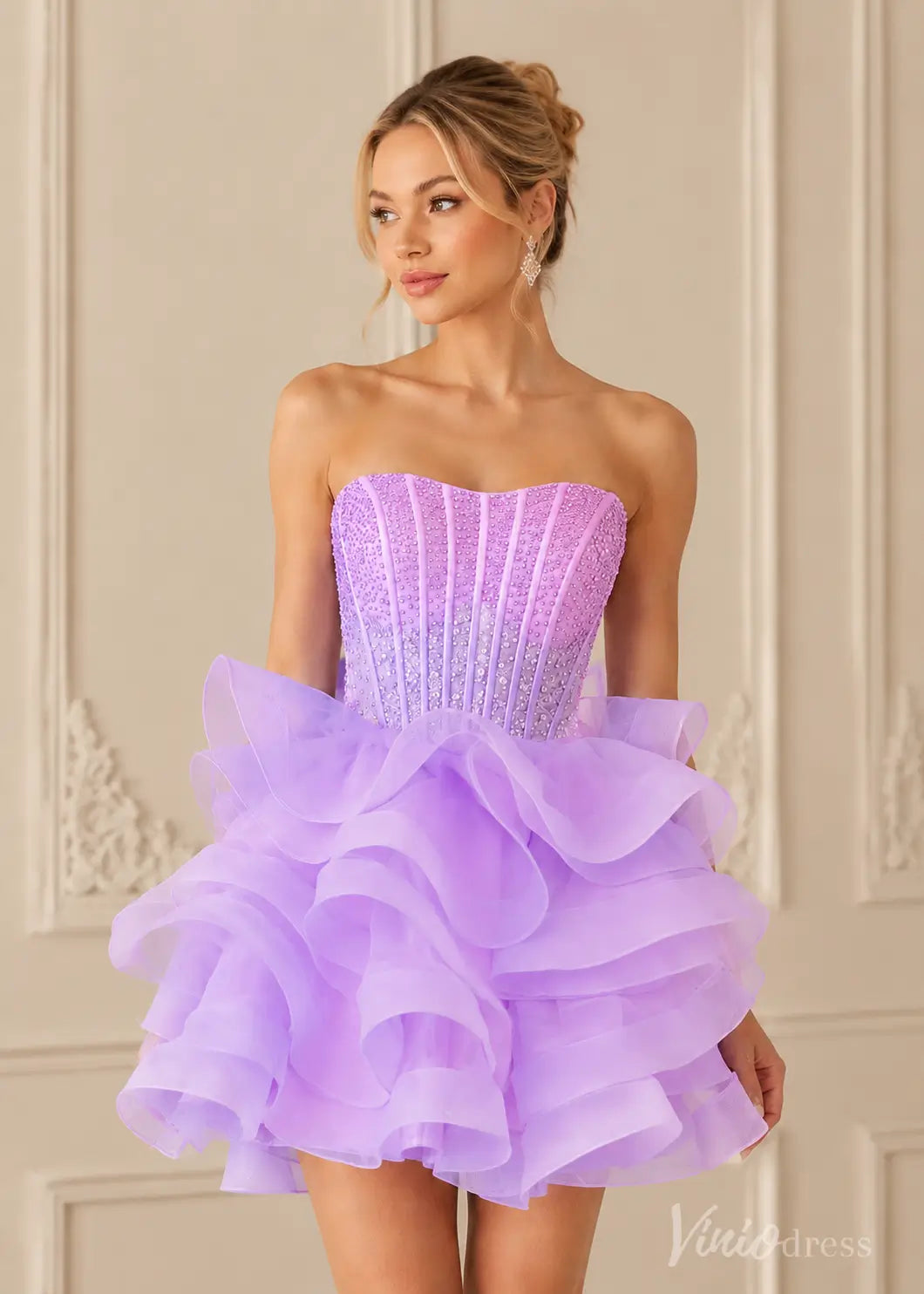 Strapless lavender mini dress with a beaded corset bodice and ruffled organza skirt.