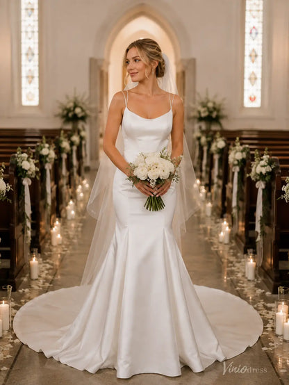 Satin mermaid wedding dress MN176 with spaghetti straps, a cowl neckline, and a long train in a church setting.