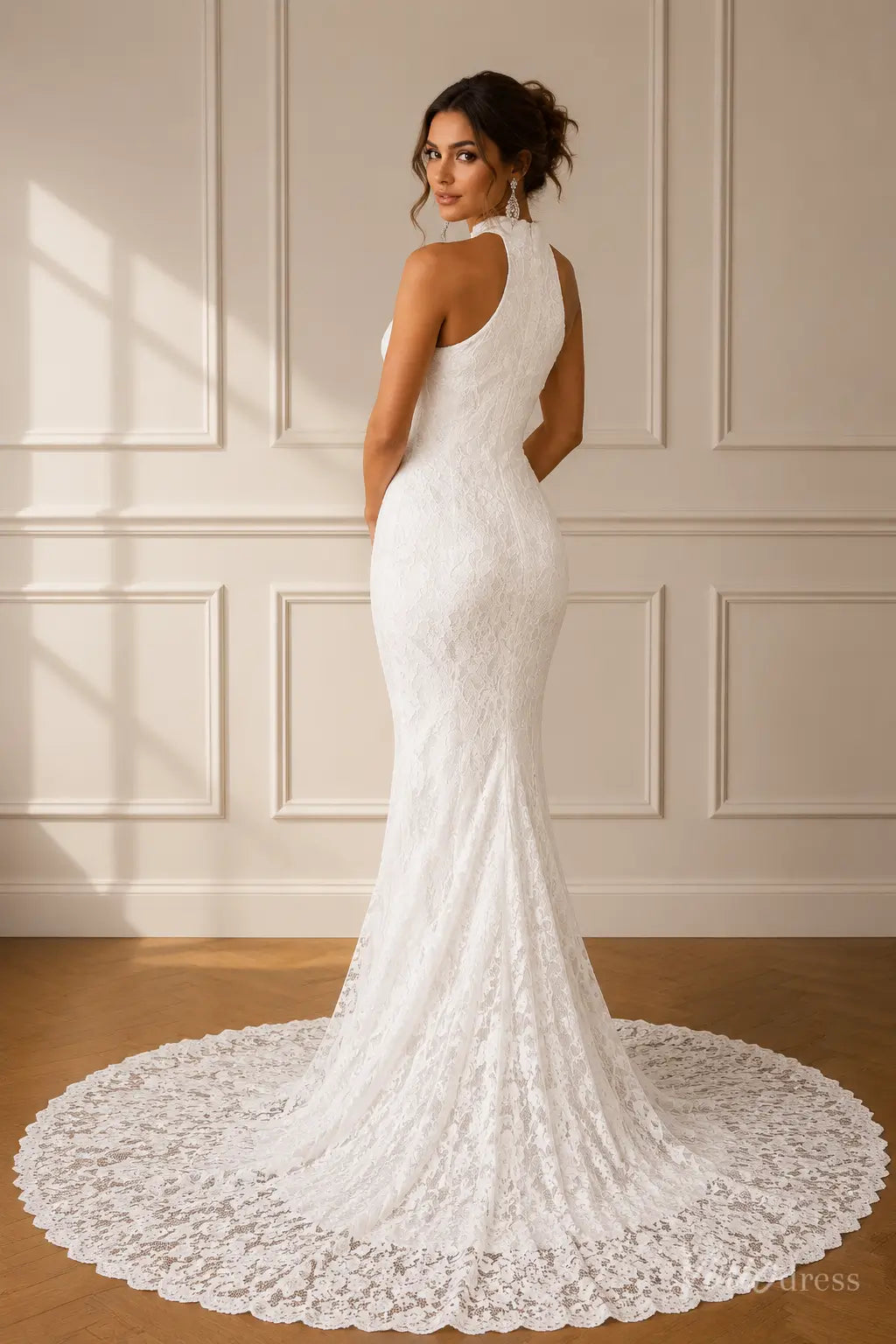 White lace mermaid wedding dress with a high halter neckline and a sweeping circular train.