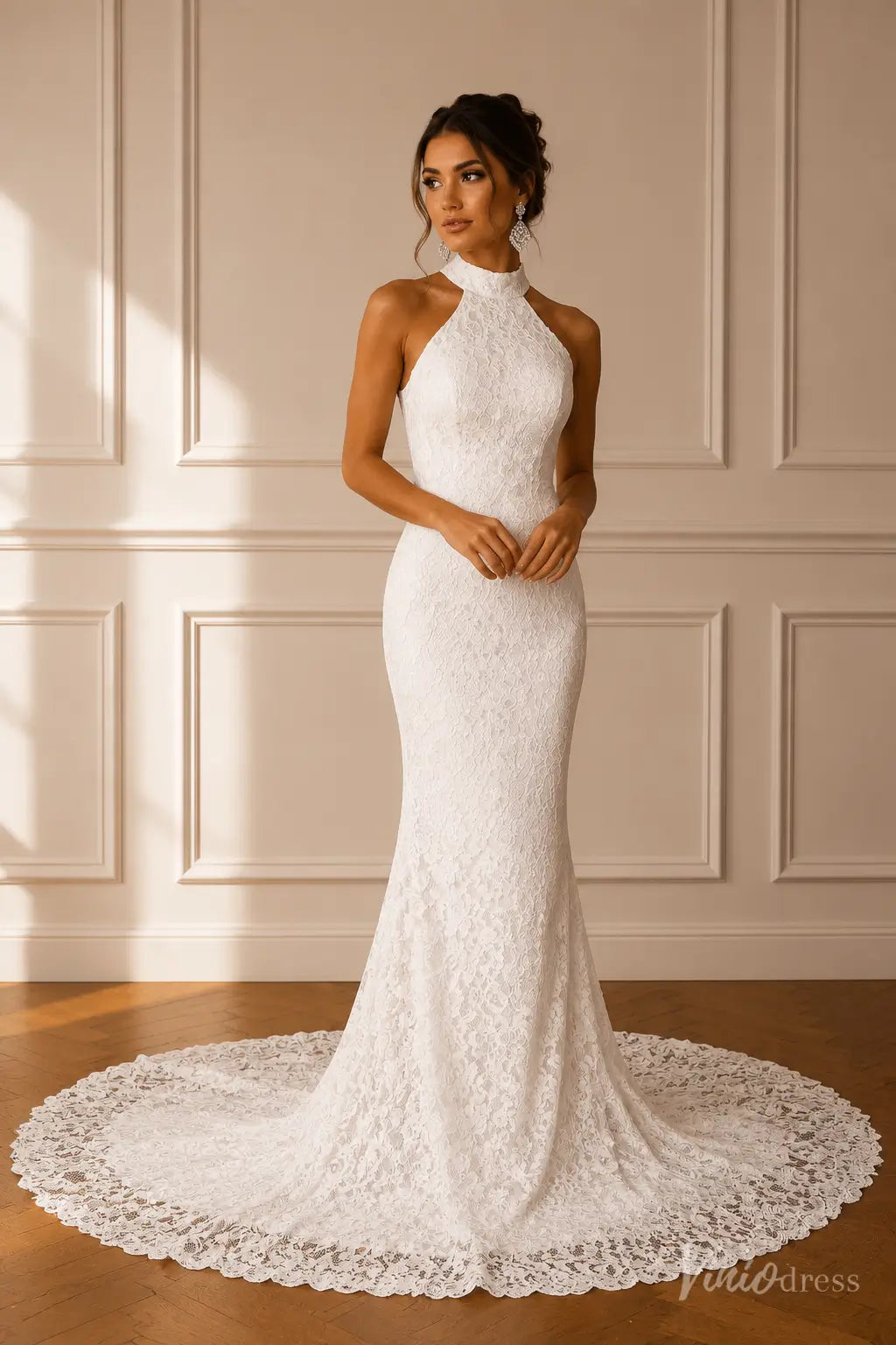 White lace mermaid wedding dress with a high halter neckline and a sweeping floor-length train.