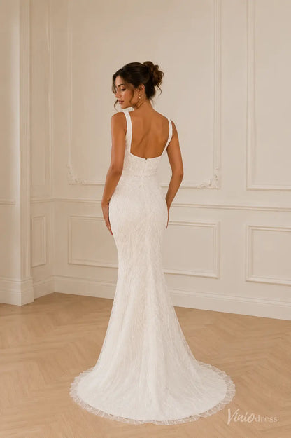 White mermaid wedding dress with square neckline, intricate lace detailing, and a low back with button closure.