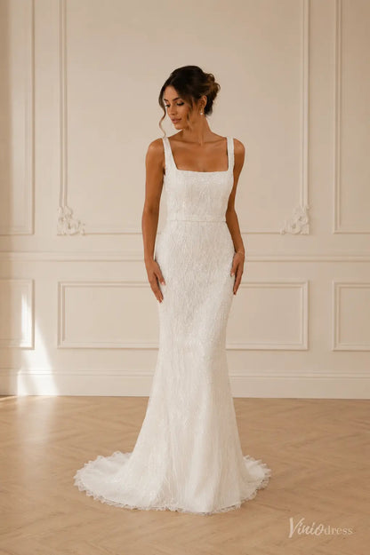 White sequined mermaid wedding dress with a square neckline and thick straps, featuring intricate beaded patterns.