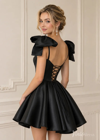 Black satin mini dress with large shoulder bows, spaghetti straps, and a lace-up corset back.