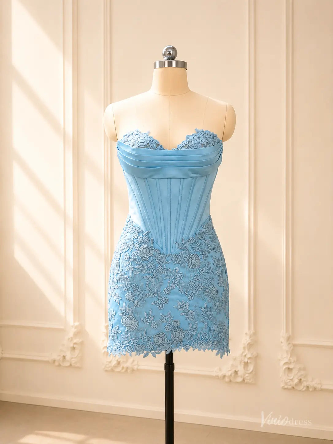 Blue strapless satin corset homecoming dress with lace sweetheart neck and fitted mini skirt.