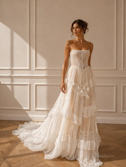 Strapless ivory wedding dress with a lace corset bodice and a tiered, ruffled tulle skirt with lace trim.